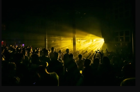 ADE techno party in Amsterdam with people dancing.